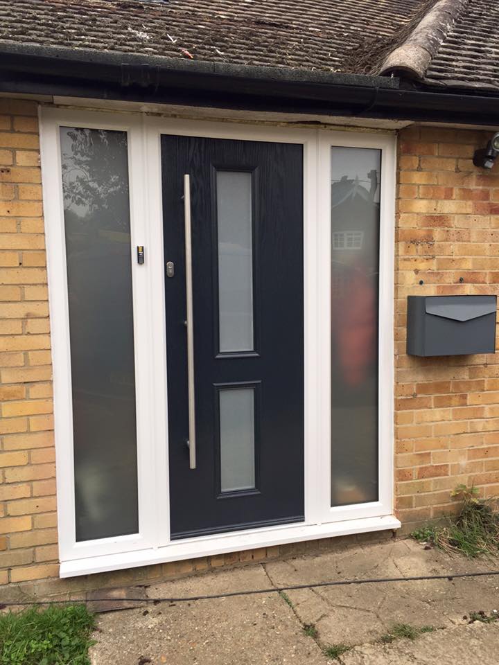 roller garage door chosen to match the colour of front door in installation by Shutter Spec Security - Thame, Oxfordshire