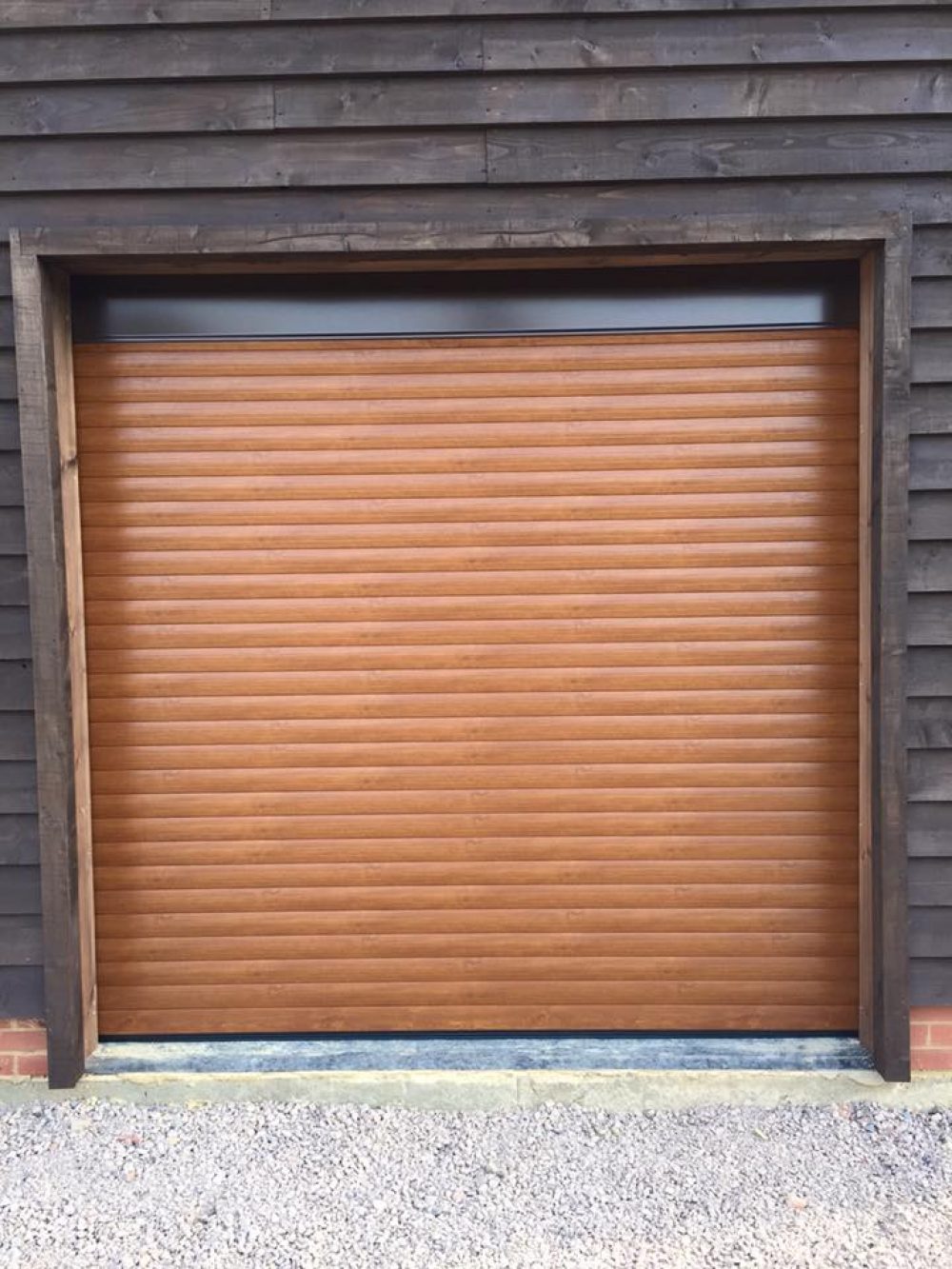 SeceuroGlide roller garage door fitted by Shutter Spec Security in a barn conversion