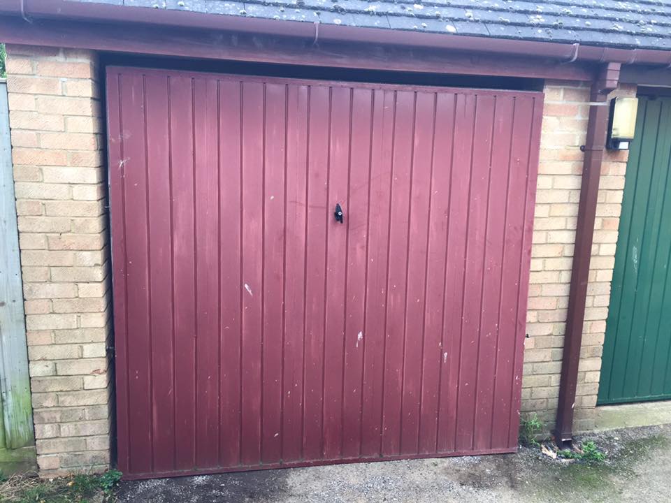 previous old garage door in red