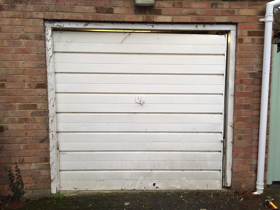 Before the installation of new garage doors by Shutter Spec Security