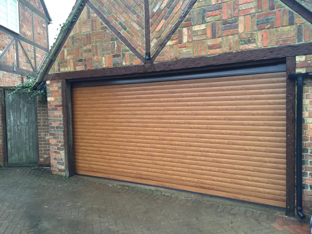 double golden oak roller garage door fitted in haddenham by Shutter Spec Security