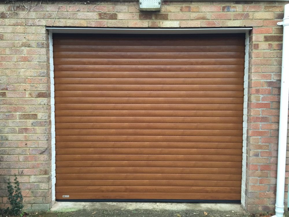 golden oak roller garage door fitted in haddenham by Shutter Spec Security