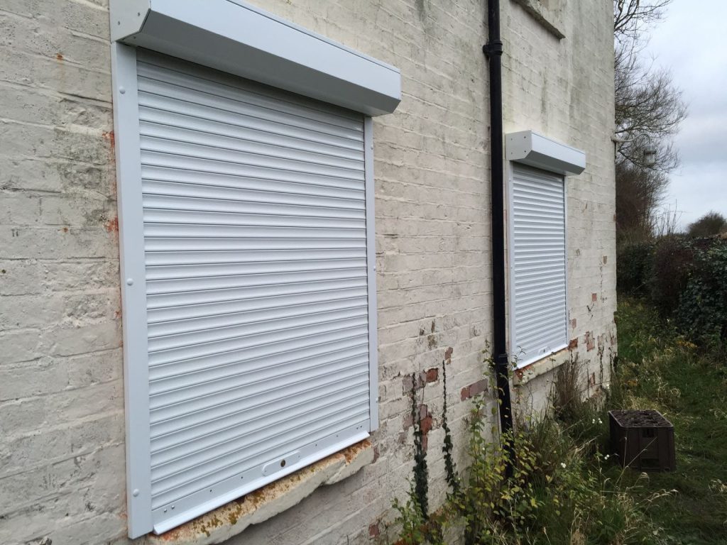 white domestic security shutters installed in Oxford by Shutter Spec Security - side view