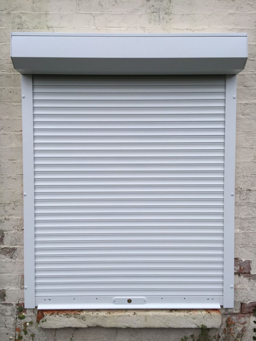 white domestic security shutters installed in Oxford by Shutter Spec Security - front view