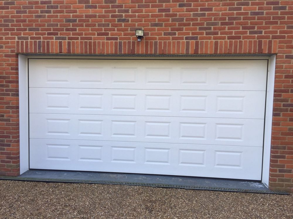 Georgian Sectional Garage Door installed in Gerrards Cross, Buckinghamshire by Shutter Spec Security.