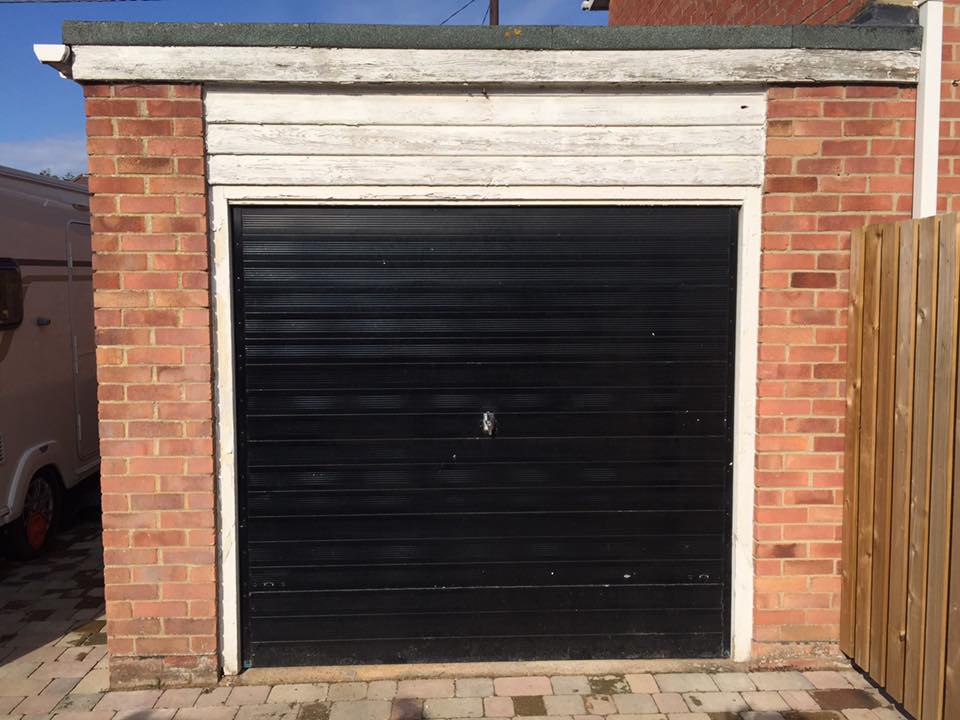 previous black up and over door replaced by Shutter Spec Security