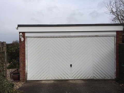 Previous double up and over garage door replaced by Shutter Spec Security.